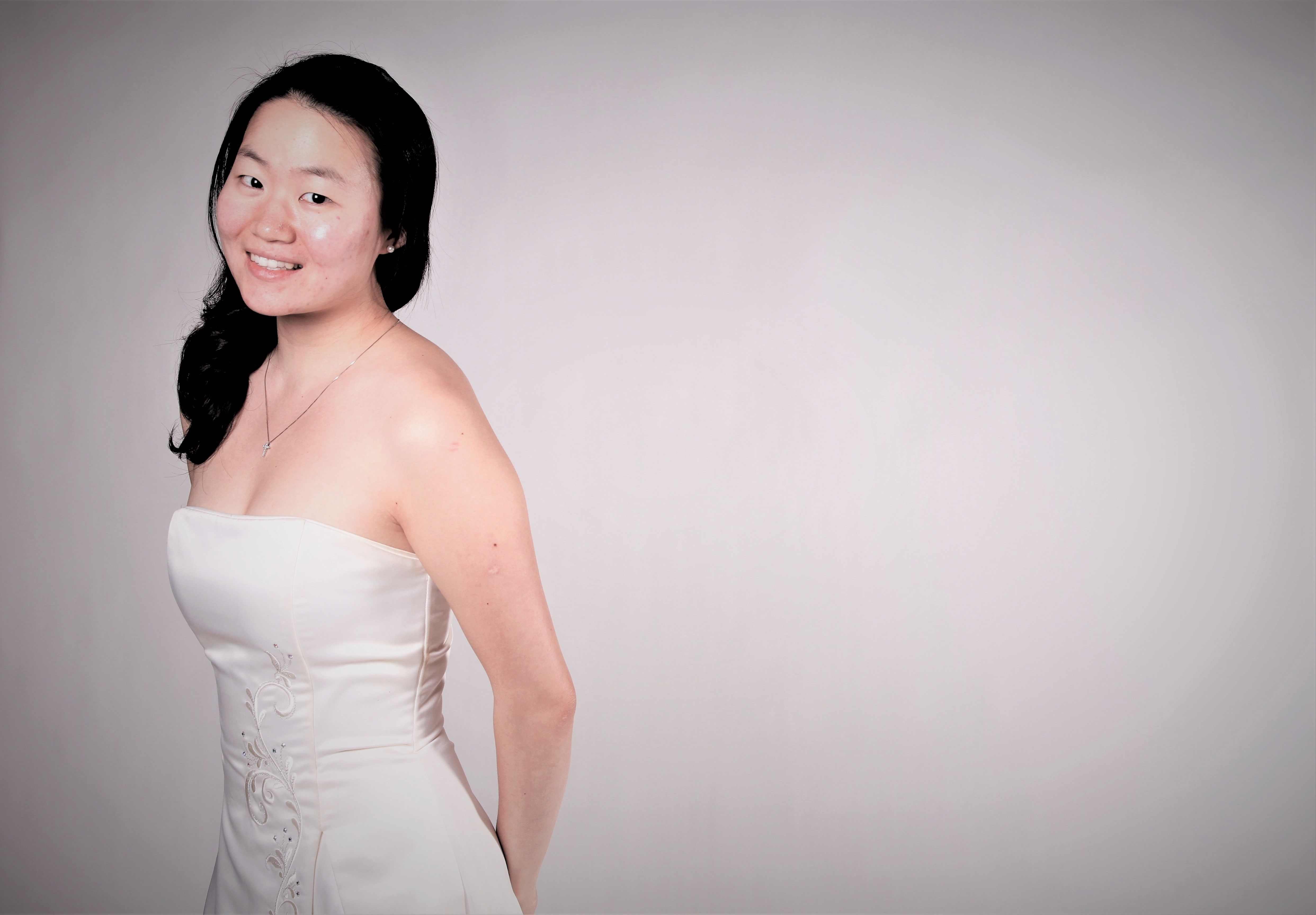 Portrait of Soojin Jin in an ivory gown